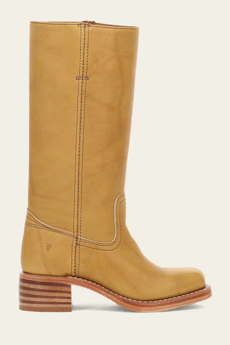 Pair of Anya classic western boots in light brown, styled with denim jeans, demonstrating their everyday wearability.
