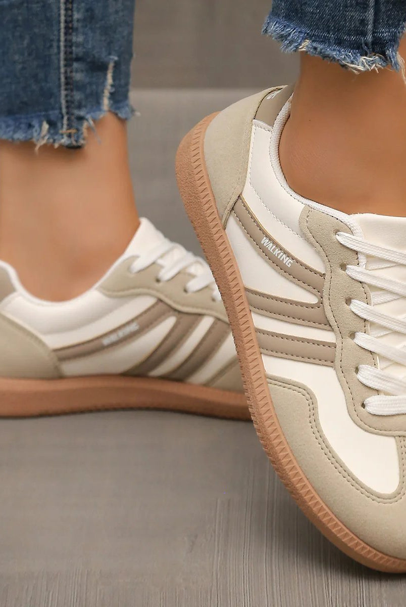 Rear view of the black Briony trainers, focusing on the heel support and subtle design elements.