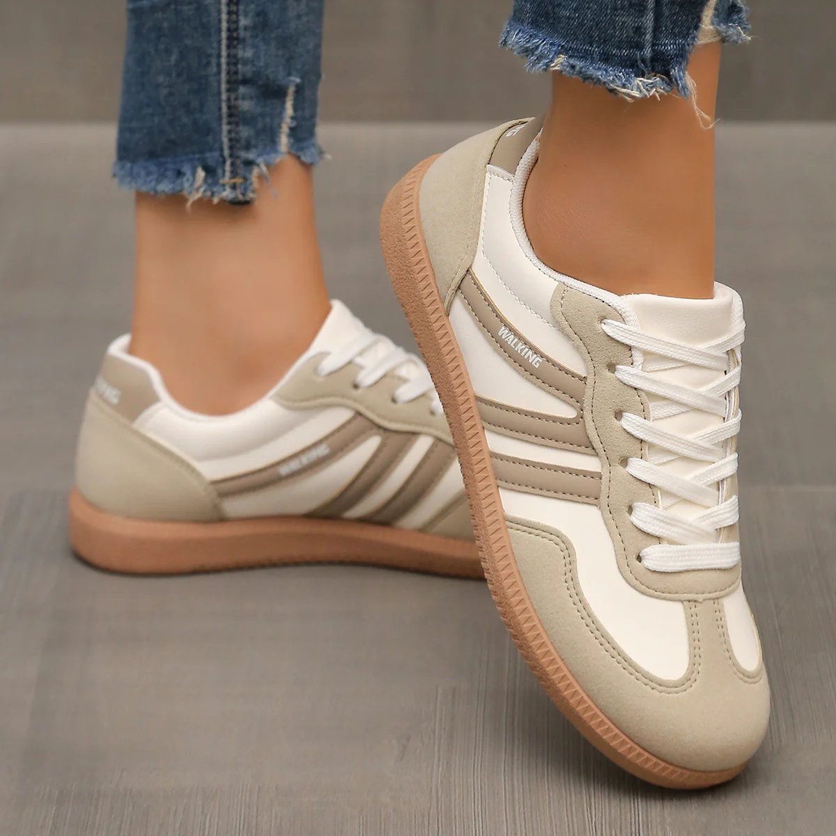 Rear view of the black Briony trainers, focusing on the heel support and subtle design elements.