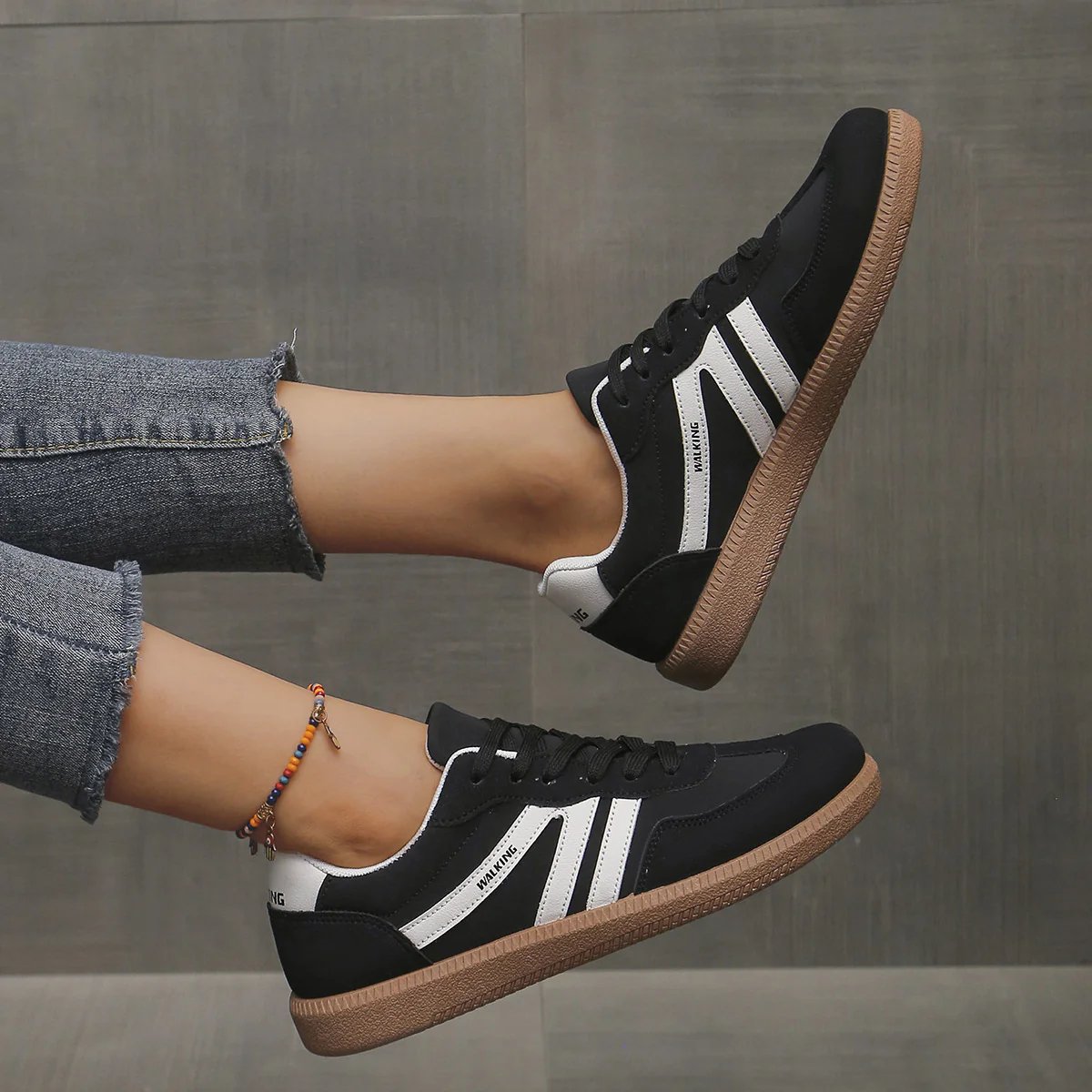 Wine red Briony orthopaedic trainers presented in a clean studio setting, showcasing rich color.