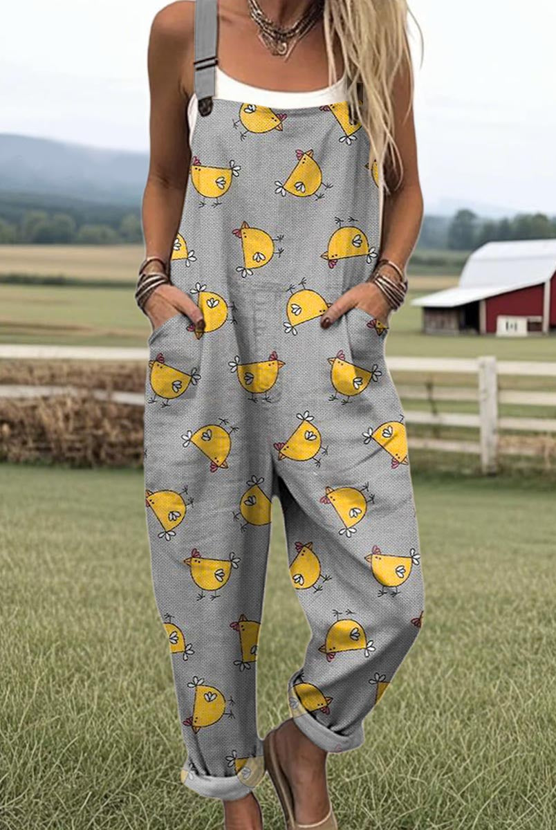 Close-up detail of the Daphne whimsical chicken jumpsuit fabric, highlighting the unique chicken print and texture from a slightly angled perspective.