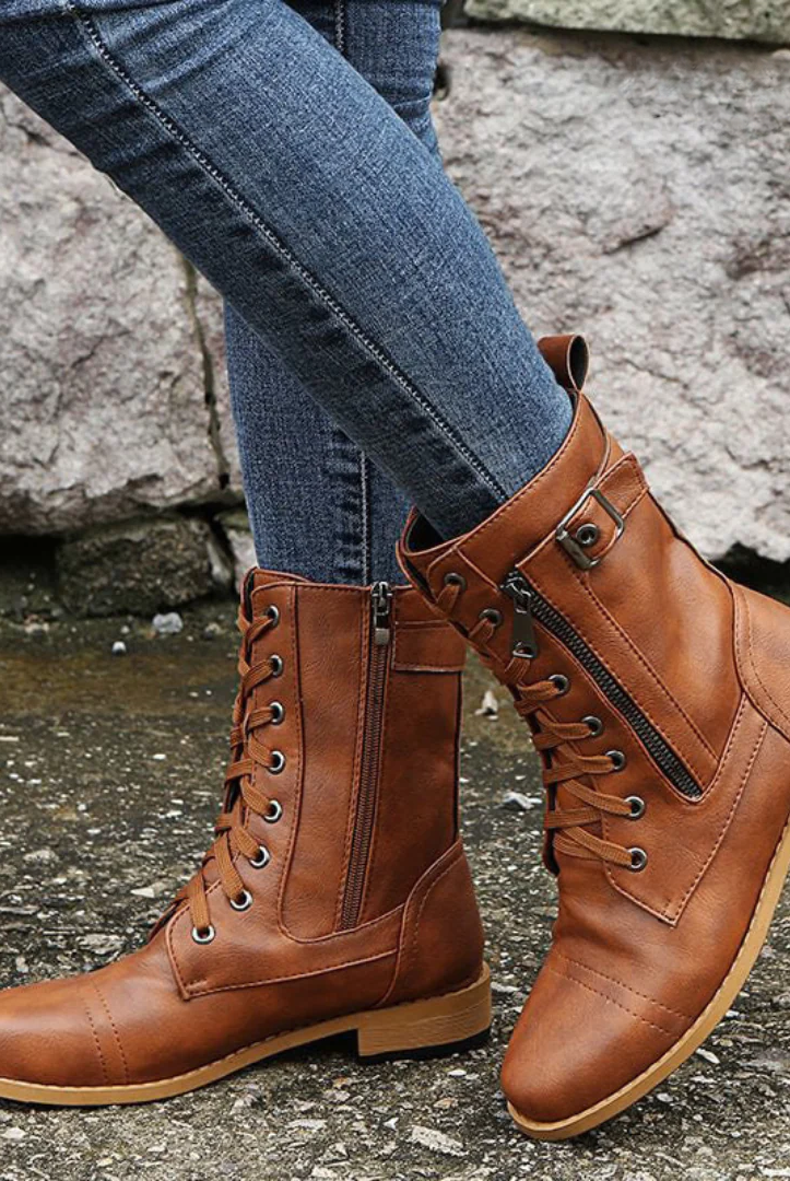 A close-up view of the Elara women's orthopedic comfort boots in black, showcasing the smooth synthetic leather and robust sole.