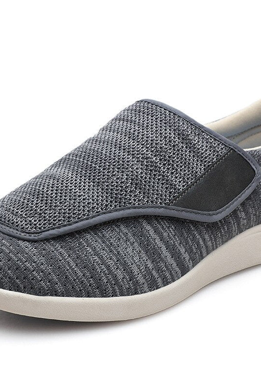 A woman walking outdoors wearing the Elara comfort shoes, showcasing their suitability for active lifestyles and pressure relief.