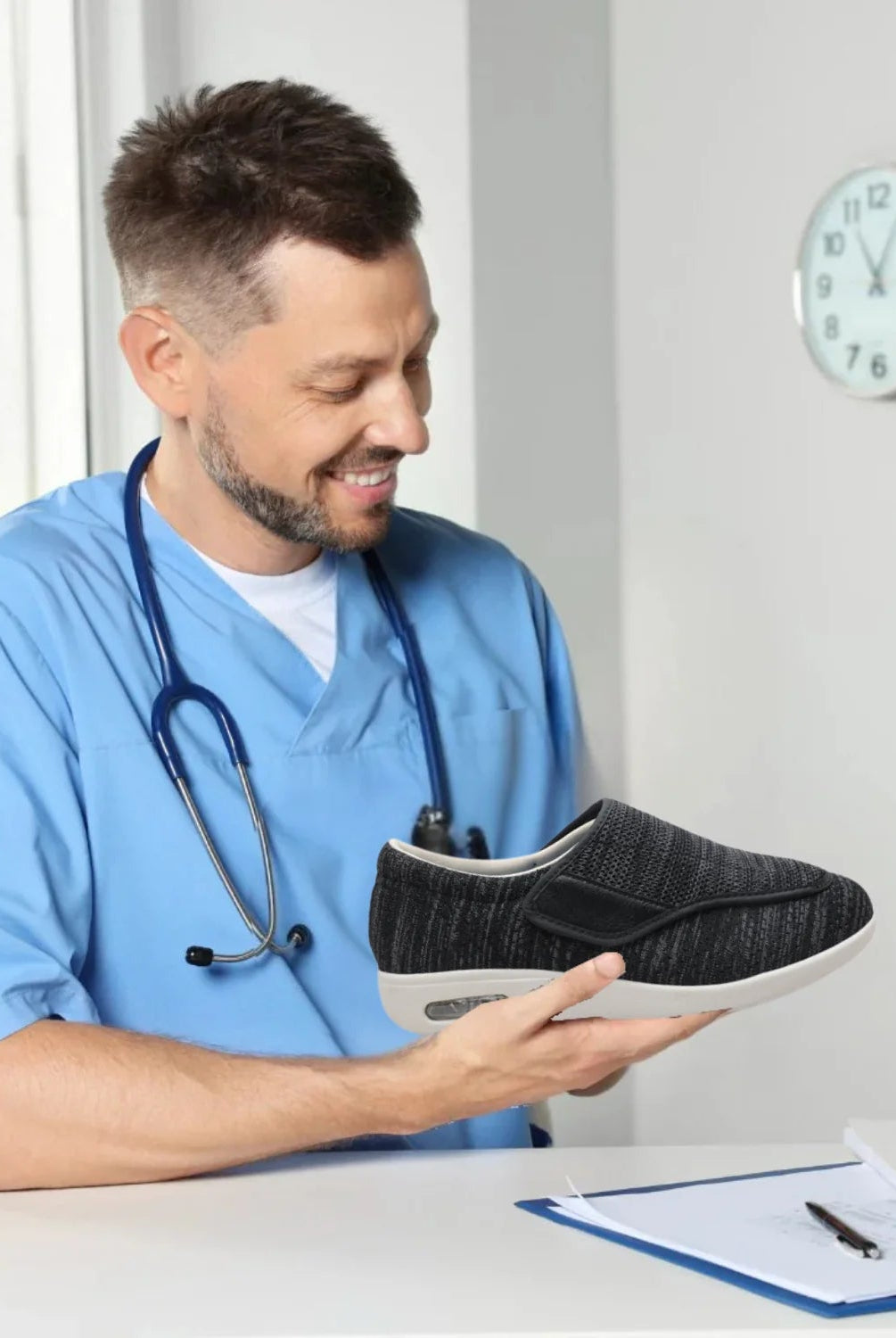 A person's hand adjusting the hook-and-loop strap on an Elara diabetic comfort shoe, demonstrating the customizable fit.