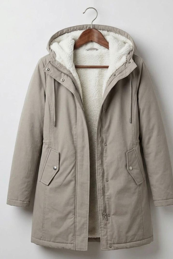 Detail of the Elara parka's hemline, indicating a clean finish and practical length.