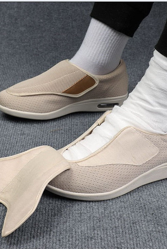 Side profile view of the gray Elara diabetic comfort shoe, highlighting the flexible sole and overall ergonomic design.
