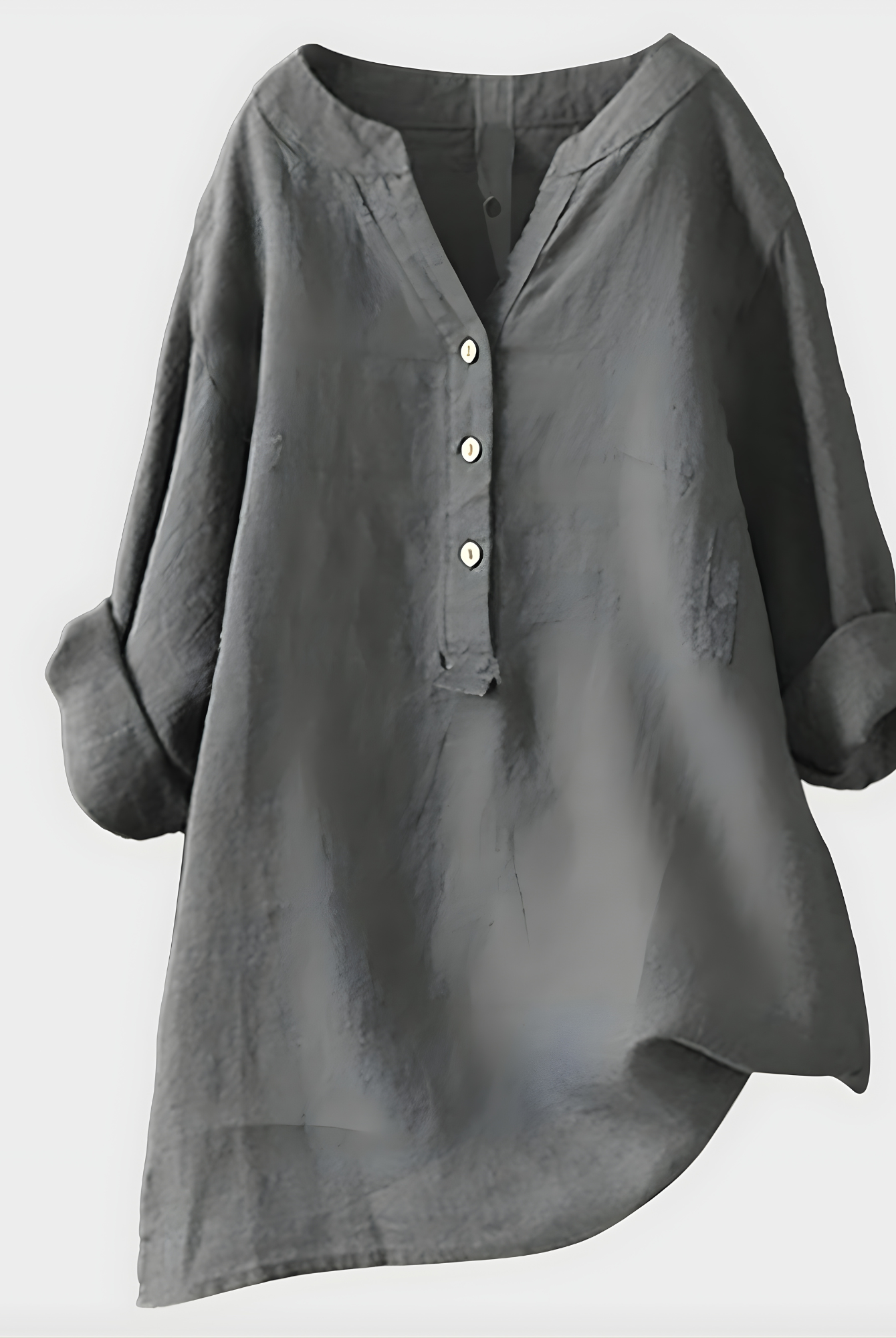 Side profile of a woman wearing the Elara elegant cotton-linen blouse in green, highlighting the relaxed fit.
