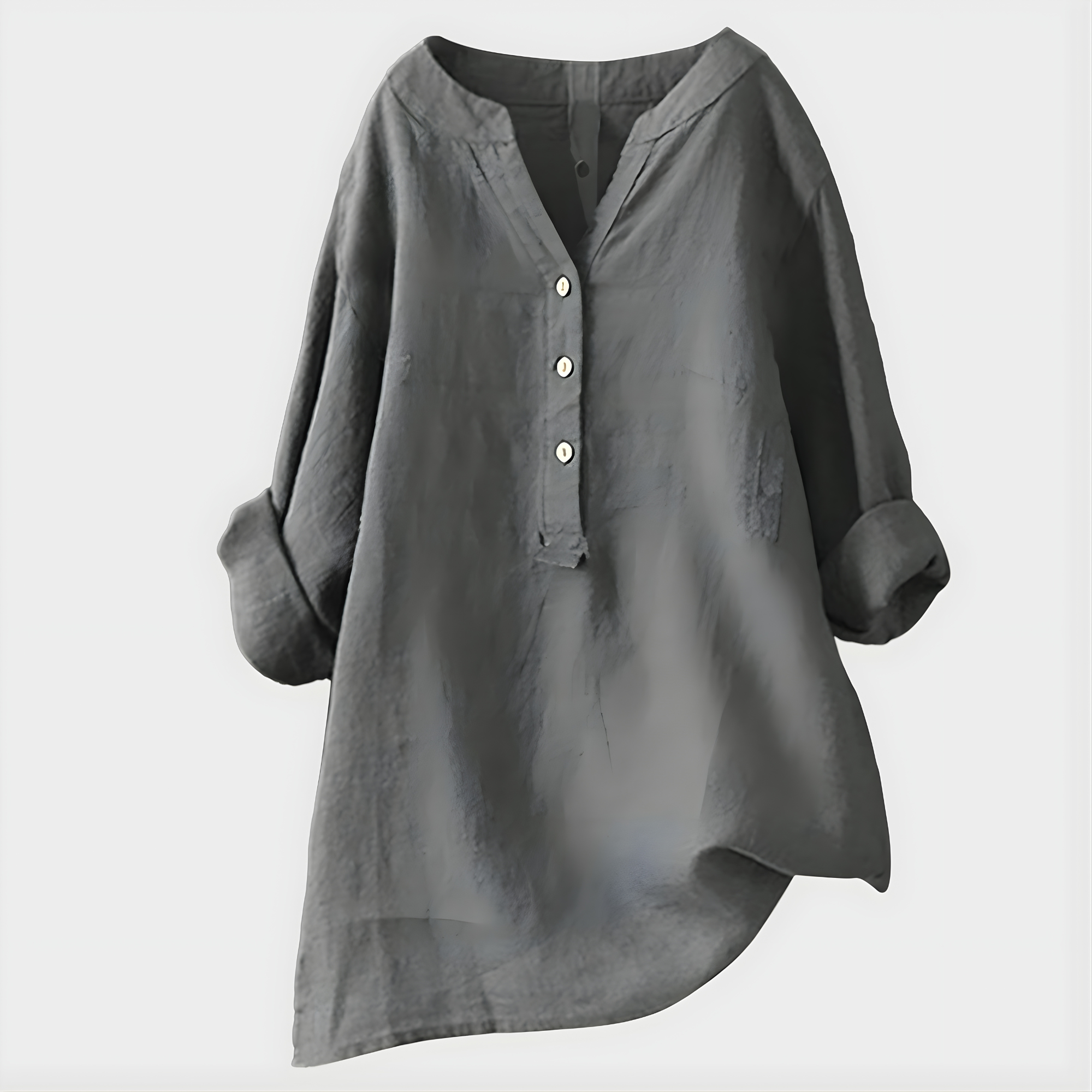 Side profile of a woman wearing the Elara elegant cotton-linen blouse in green, highlighting the relaxed fit.