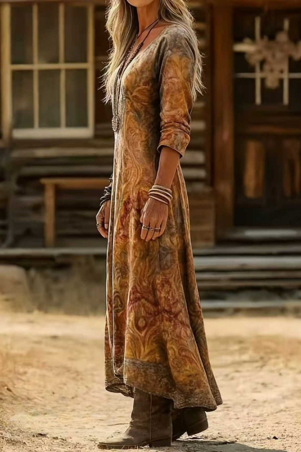 Side profile of a woman in the flowing Elara bohemian floral maxi dress, showcasing its relaxed fit.