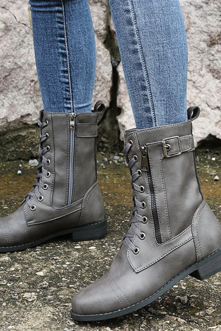 Detail of the side zipper and textured anti-slip sole on the Elara women's comfort boots, emphasizing their practical features.
