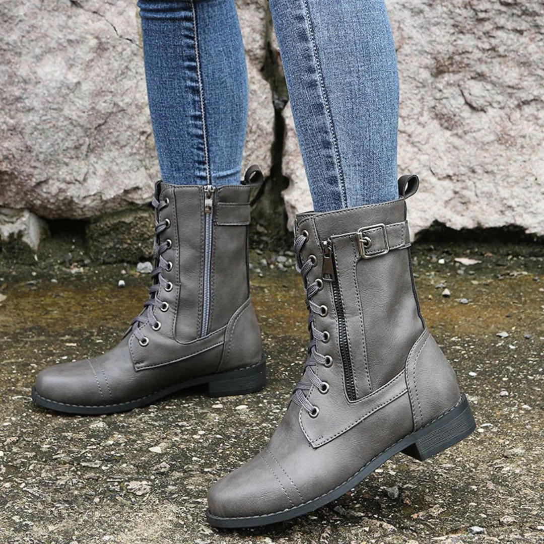Detail of the side zipper and textured anti-slip sole on the Elara women's comfort boots, emphasizing their practical features.