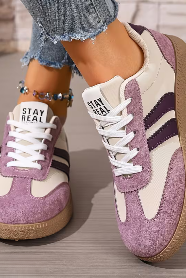 A pair of Elara orthopedic comfort shoes displayed against a clean background, illustrating the lightweight construction and modern aesthetic.