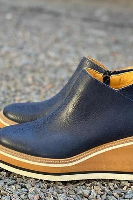 Product lineup of all available colors of Elara casual wedge ankle boots on a neutral background.