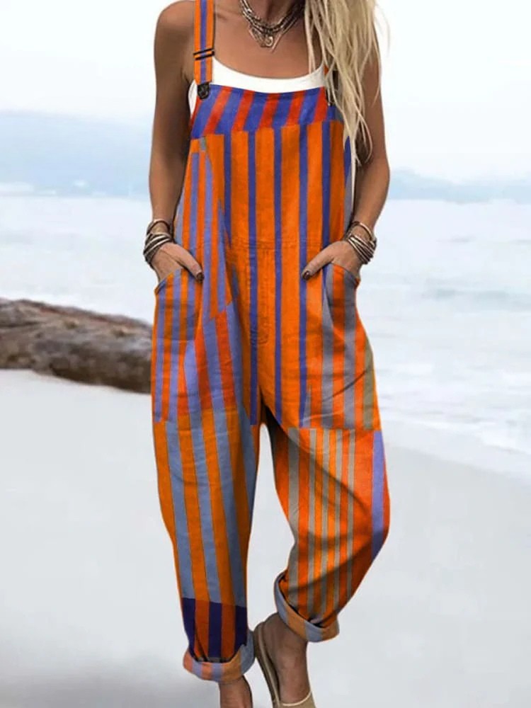 Front view of the Elodie striped relaxed jumpsuit in vibrant orange, blue, and violet, showcasing the adjustable straps and deep pockets on a model.