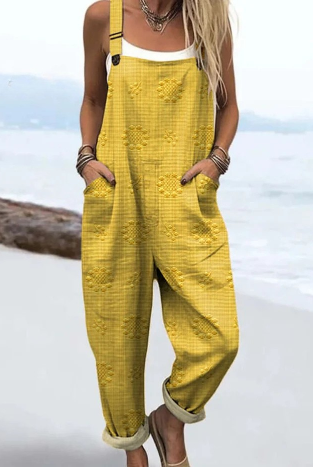Woman enjoying an outdoor setting, styled casually in the comfortable Evanthe floral pattern jumpsuit.