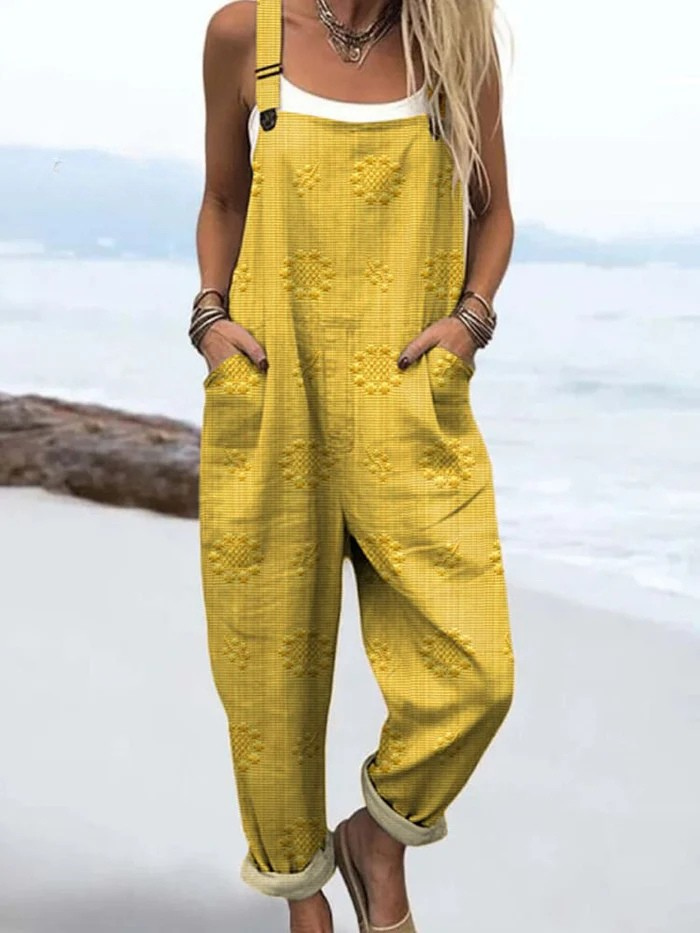 Woman enjoying an outdoor setting, styled casually in the comfortable Evanthe floral pattern jumpsuit.