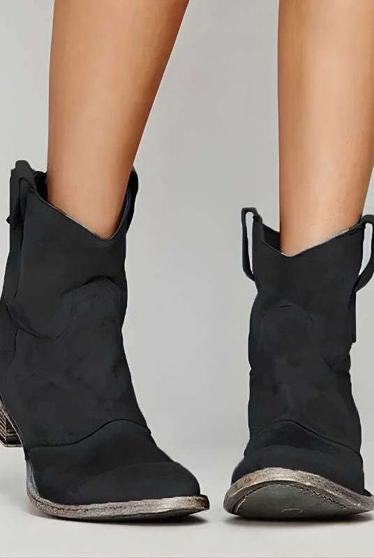Side profile of a black Hadley vintage cowboy ankle boot, highlighting the comfortable heel and textured leather finish.