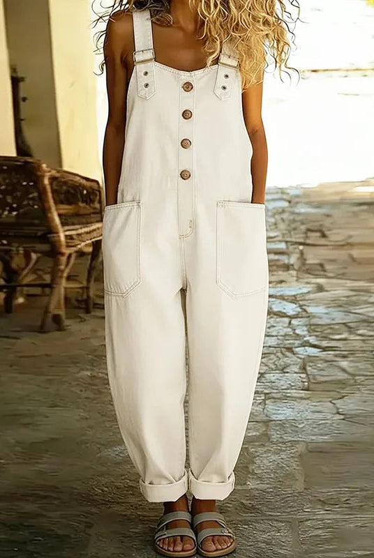 Back view of the Hadley soft denim overalls on a model, emphasizing the overall design and practical pocket placement.