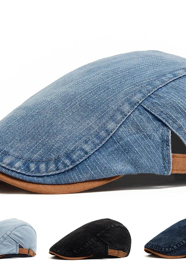 Front view of a dark blue premium denim flat cap, showcasing its classic shape and textured fabric.