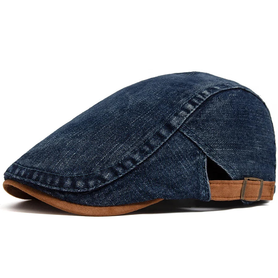 Close-up of the high-quality denim fabric on the flat cap, revealing its intricate weave and rich texture.