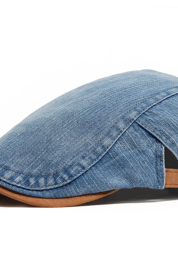 A man wearing the Kian premium denim flat cap, styled casually outdoors, demonstrating its versatile appeal.