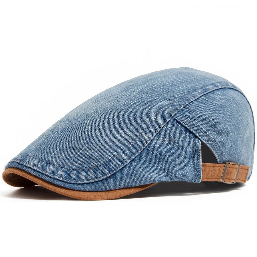 A man wearing the Kian premium denim flat cap, styled casually outdoors, demonstrating its versatile appeal.