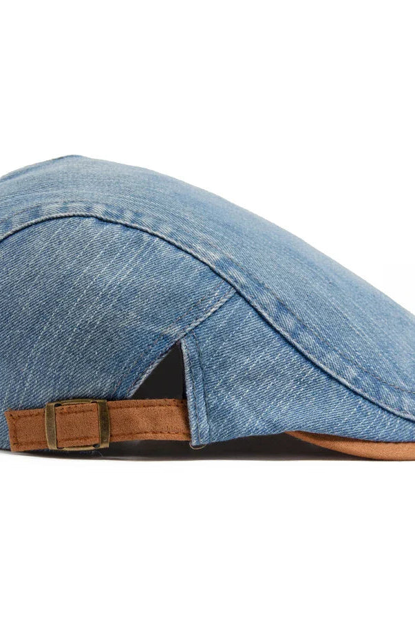Three premium denim flat caps in black, light blue, and dark blue, arranged neatly on a wooden surface.