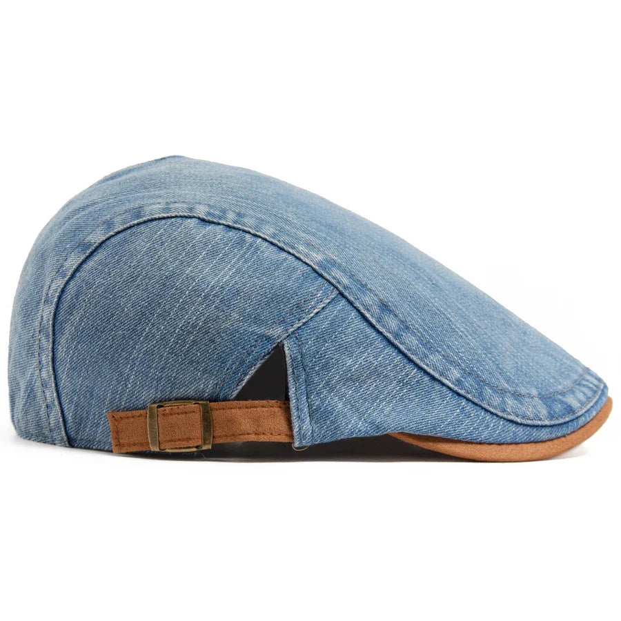 Three premium denim flat caps in black, light blue, and dark blue, arranged neatly on a wooden surface.