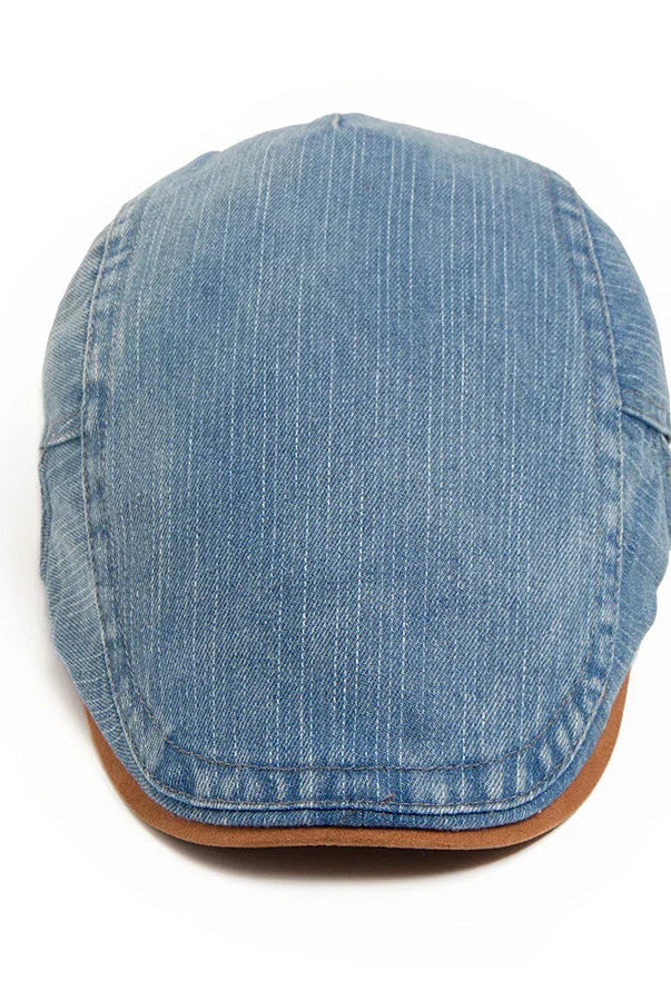Detail shot of the cap's brim, emphasizing the sturdy construction and subtle stitching of the premium denim flat cap.