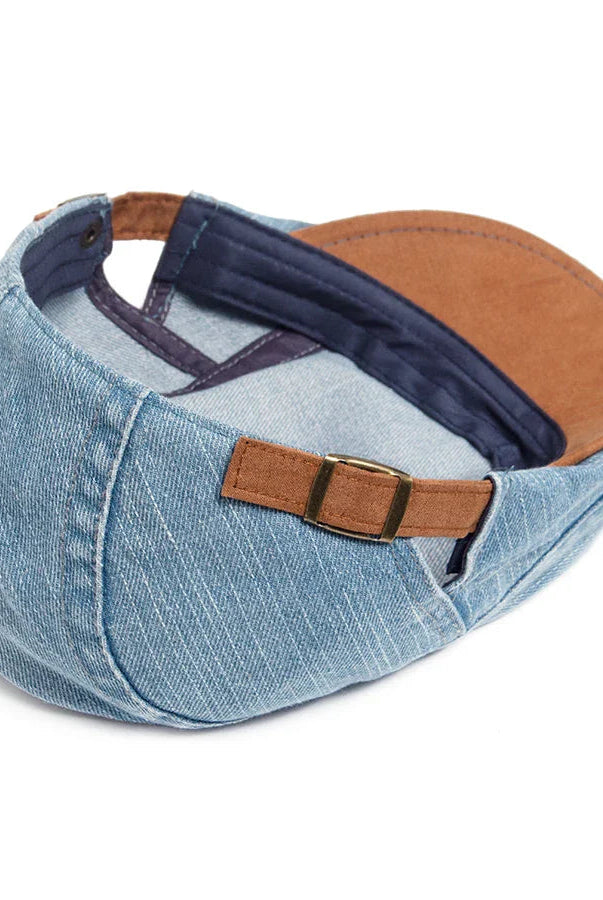Overhead view of the premium denim flat cap, showing the top paneling and overall symmetrical design.