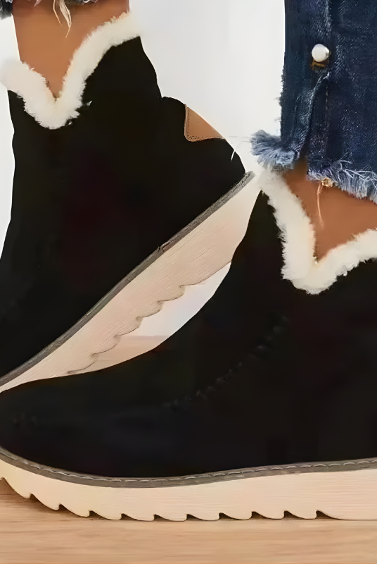 Close-up of the side profile of a brown Kira orthopedic ankle boot, highlighting the texture and zipper.