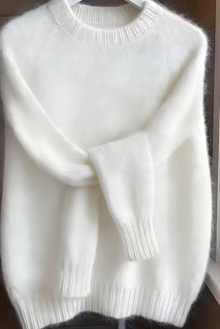 Back view of the white Lila cashmere-blend sweater, illustrating its comfortable and relaxed silhouette.