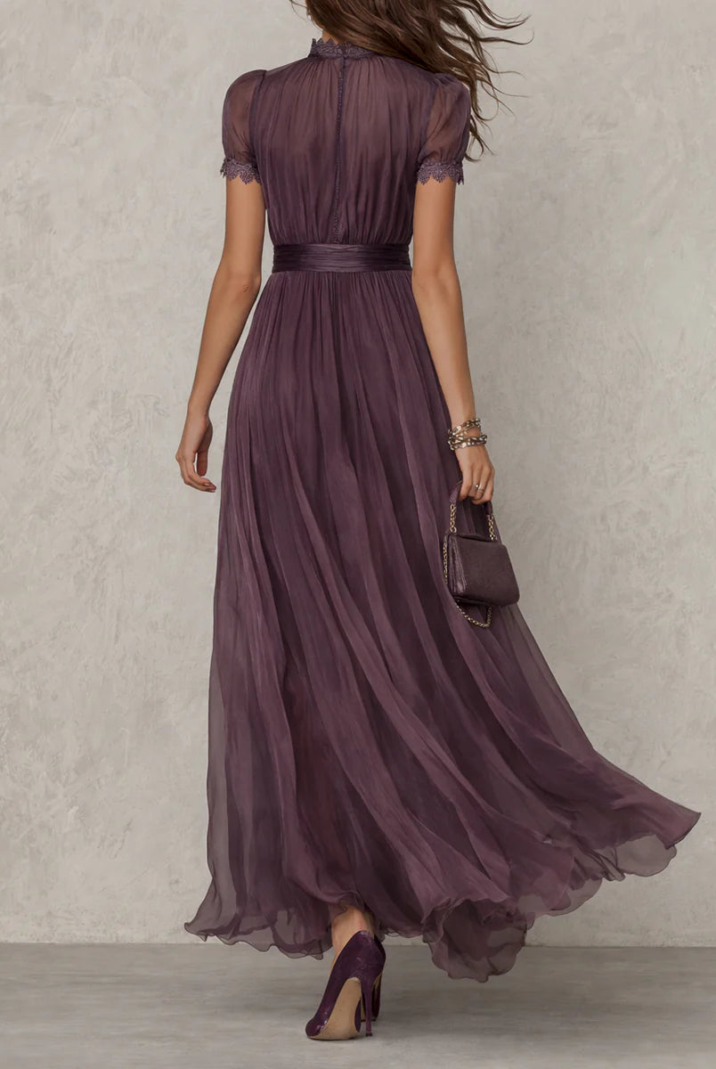 Close-up detail of the keyhole neckline and the intricate lace border on the Lyra purple dress.