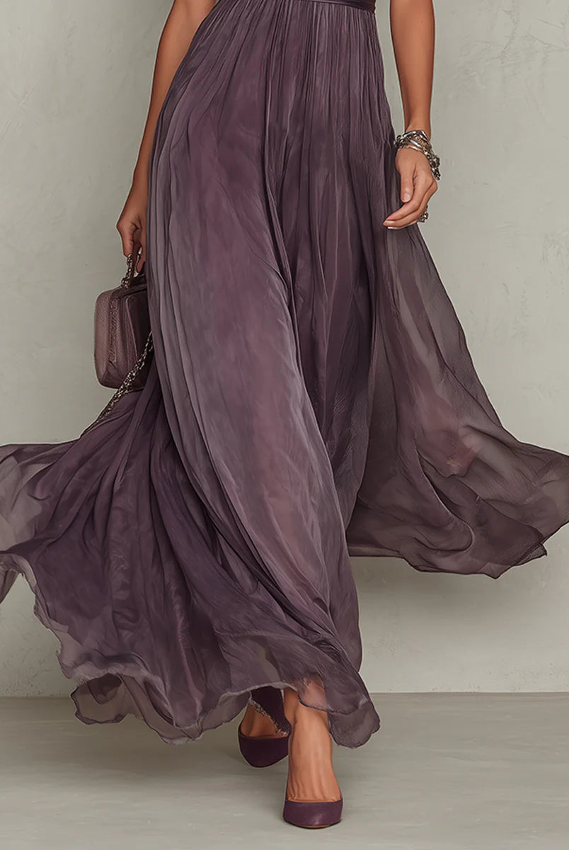 Lifestyle shot of the Lyra maxi dress in motion, illustrating its elegant flow and comfortable fit for spring events.