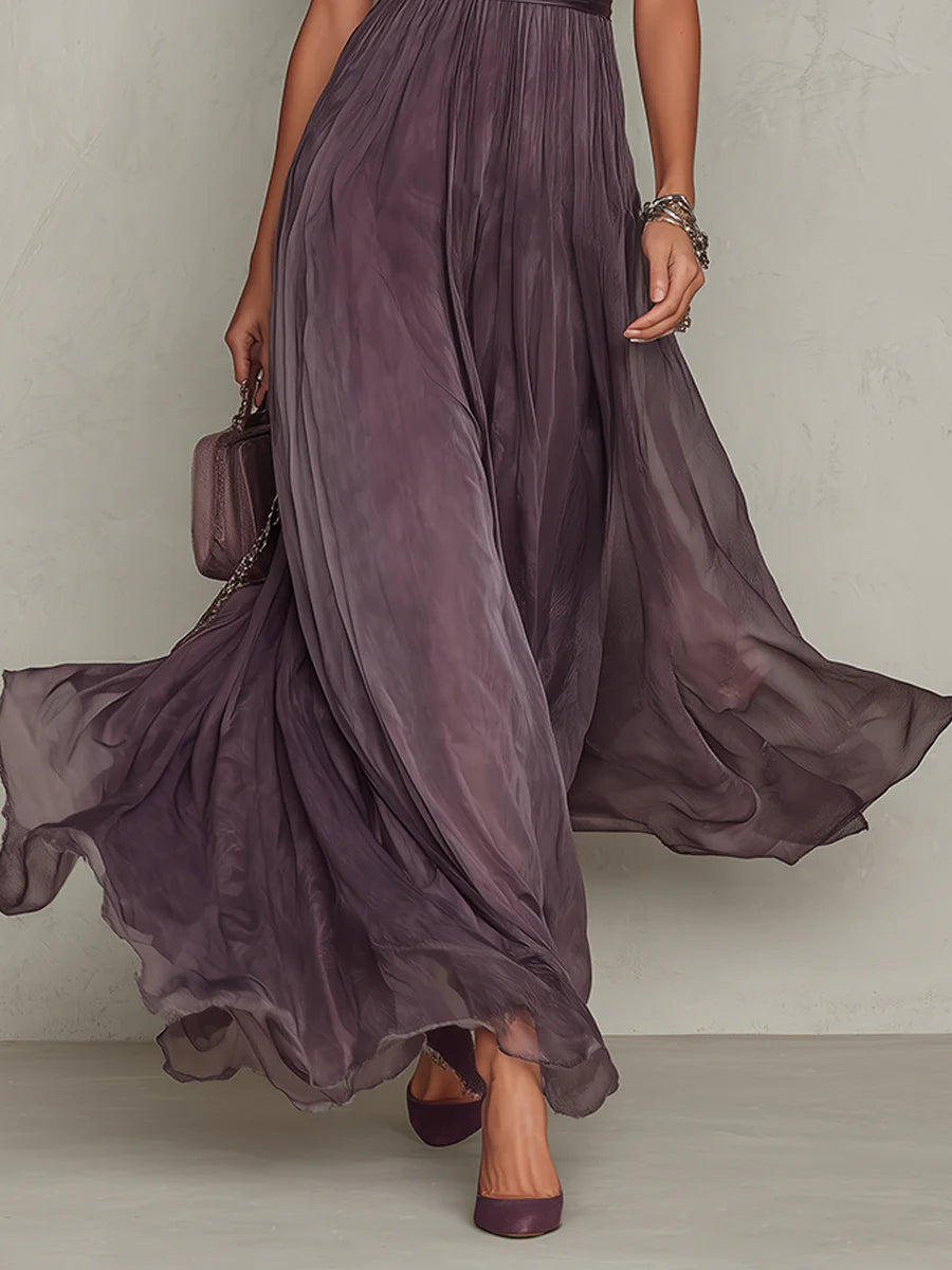 Lifestyle shot of the Lyra maxi dress in motion, illustrating its elegant flow and comfortable fit for spring events.