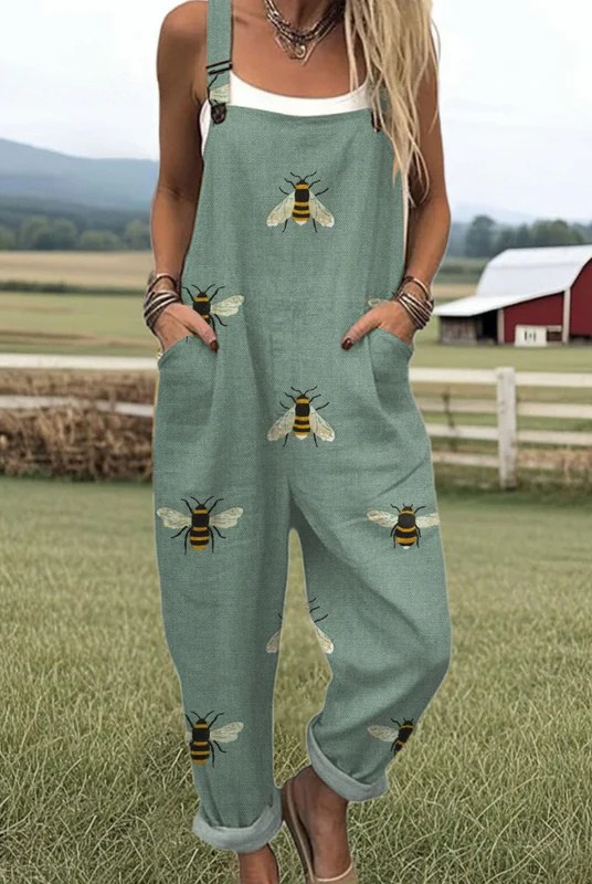 Front view of the Marlena sage green bee print jumpsuit, styled casually for a relaxed outdoor setting.