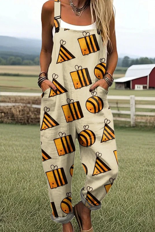 Front view of the Seraphina whimsical bee print jumpsuit on a model, showcasing its relaxed fit and graphic bee pattern on a light background.