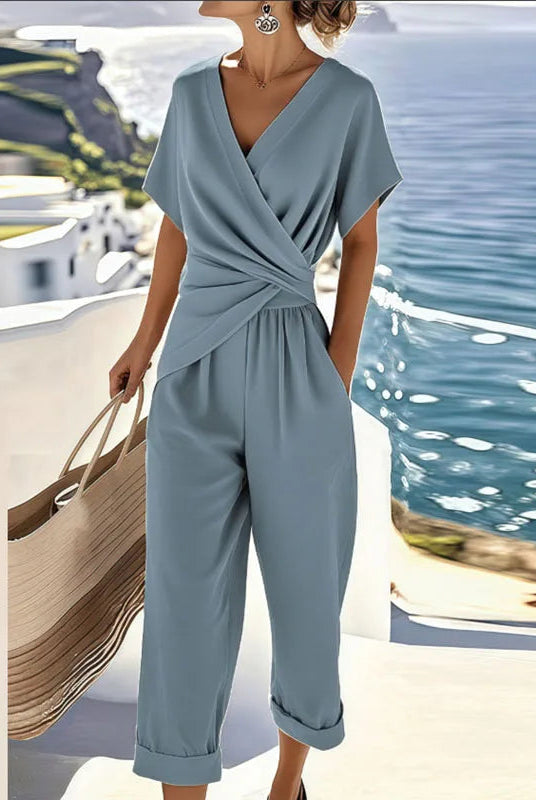 Side profile of the refined two-piece outfit in blue, highlighting the flowing fabric and comfortable fit for women.