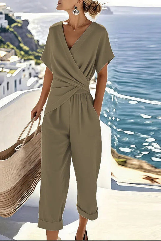 Close-up detail of the fabric texture and stitching on the khaki refined two-piece outfit, emphasizing quality.