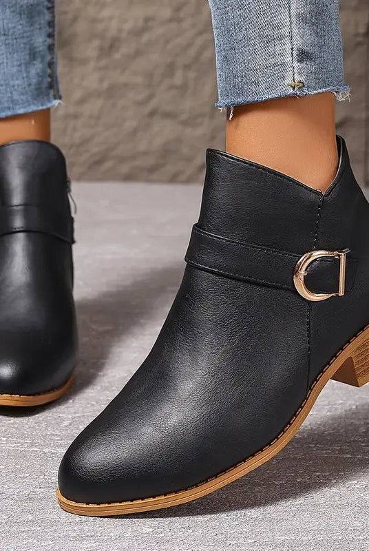 Texture detail of the synthetic leather material used in the Zara comfort ankle boot, showing its quality.