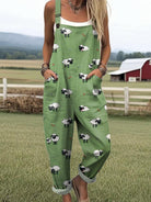 Front view of the Adira playful sheep jumpsuit, showcasing its earthy brown fabric, bib front, and whimsical sheep pattern.