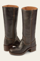 Detail shot of the stacked block heel on the black Anya classic western boots, revealing its robust layered design.