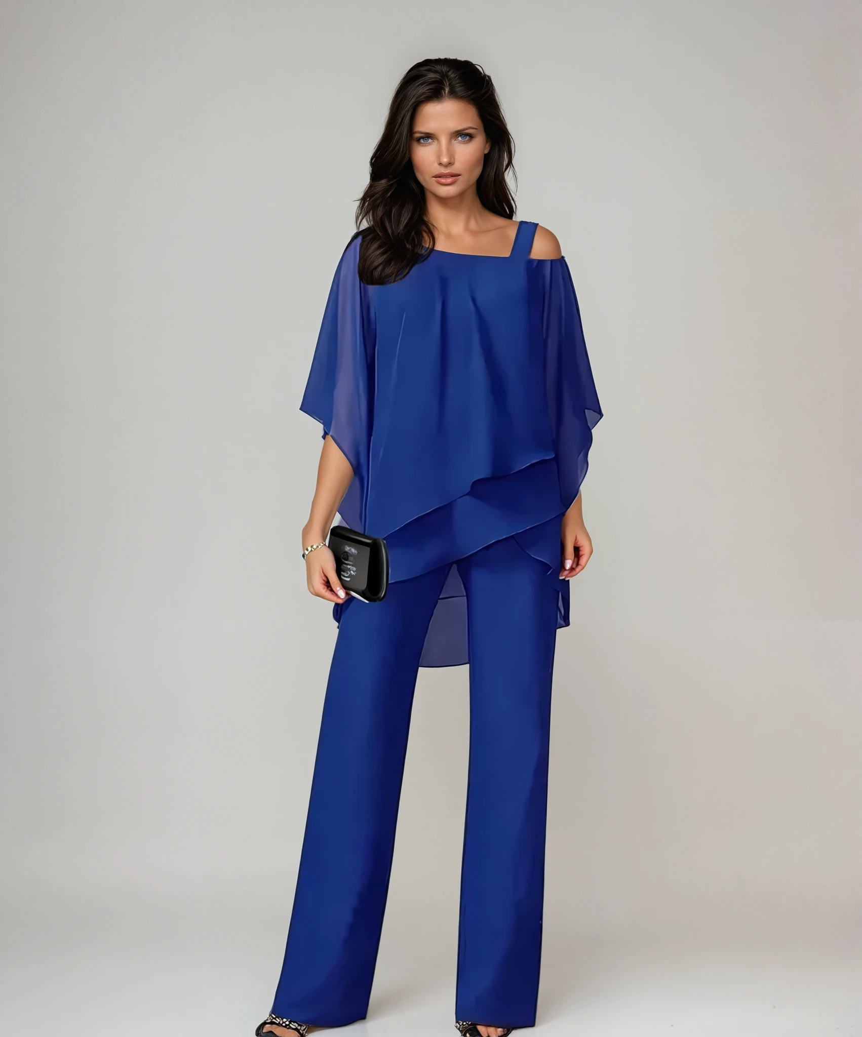 Side profile of a woman wearing the Aviana two-piece layered set in white, highlighting the graceful drape and relaxed fit.