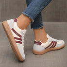 Brown Briony orthopaedic trainers, positioned to highlight the material texture and robust construction.