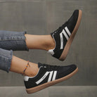 Wine red Briony orthopaedic trainers presented in a clean studio setting, showcasing rich color.