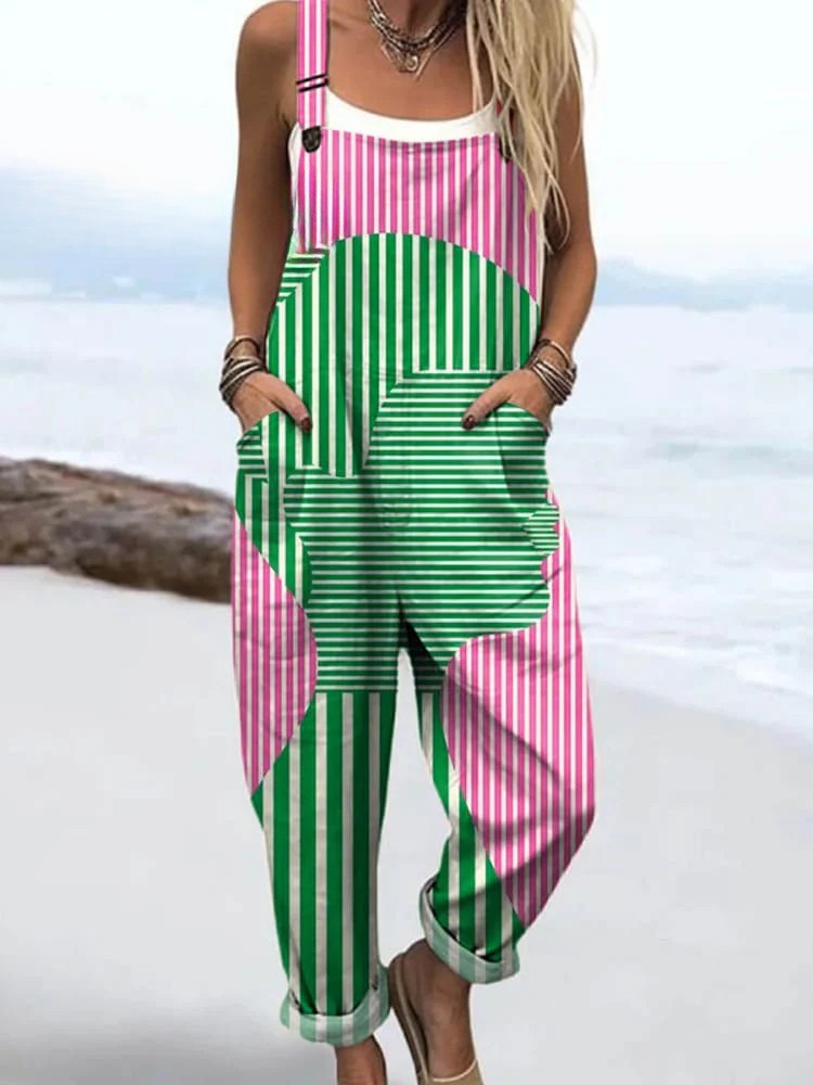 Front view of the Calla artistic abstract jumpsuit, featuring a striking pink and green geometric pattern with a central human figure outline.