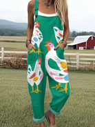 Front view of a woman wearing the vibrant green Cassia chicken print jumpsuit, styled with rolled cuffs.
