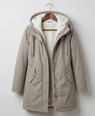 Detail of the Elara parka's hemline, indicating a clean finish and practical length.