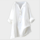 Back view of the Elara blouse in light grey, showing the gentle drape and sophisticated design.