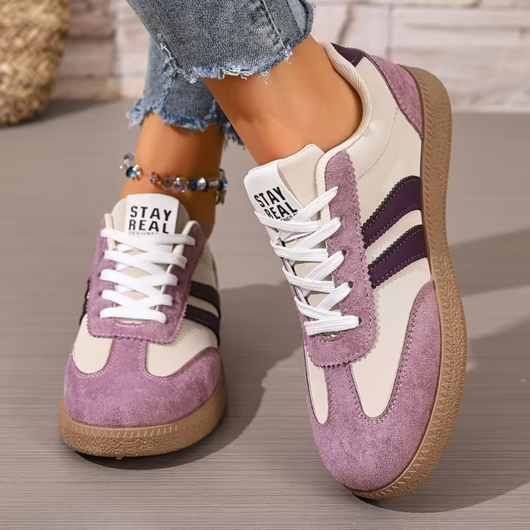 A pair of Elara orthopedic comfort shoes displayed against a clean background, illustrating the lightweight construction and modern aesthetic.